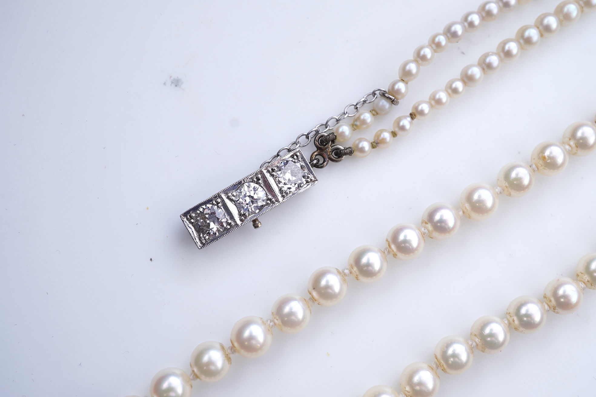 A cultured pearl and diamond necklace, early 20th century